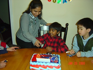 My mama helping me to cut cake